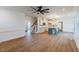 Open concept living room featuring hardwood floors, kitchen, and staircase at 48 Sanders Farm Dr, Smithfield, NC 27577