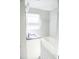Bathroom featuring dark countertop, bathtub, and tile floor at 4813 Glen Forest Dr, Raleigh, NC 27612