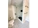 Bathroom featuring glass shower with subway tile and black accents at 4813 Glen Forest Dr, Raleigh, NC 27612