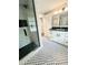 Bathroom featuring shower with subway tile and vanity featuring dark countertop at 4813 Glen Forest Dr, Raleigh, NC 27612