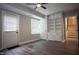 Bonus room with built in shelves, a door to the exterior, and a door to the stairwell at 4813 Glen Forest Dr, Raleigh, NC 27612