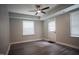 Bonus room with a view of the backyard, an exterior door, and ceiling fan at 4813 Glen Forest Dr, Raleigh, NC 27612