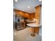 Well-lit kitchen featuring stainless steel appliances, light-colored countertops, and hardwood cabinets at 4813 Glen Forest Dr, Raleigh, NC 27612