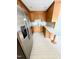 Functional kitchen with stainless steel appliances, wooden cabinetry, and an efficient layout at 4813 Glen Forest Dr, Raleigh, NC 27612