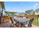 Back deck and patio features an outdoor table and chairs with neighborhood views at 508 Minerva Dale Dr, Fuquay Varina, NC 27526