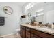 Bathroom with double sink vanity, granite countertop, and decorative accents at 508 Minerva Dale Dr, Fuquay Varina, NC 27526
