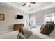 This bedroom features a tray ceiling, fan, and plenty of closet space at 508 Minerva Dale Dr, Fuquay Varina, NC 27526