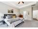 This spacious bedroom features a tray ceiling, fan, and an attached bath at 508 Minerva Dale Dr, Fuquay Varina, NC 27526