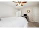 Neutral bedroom with carpet, ceiling fan, and a door leading to the en suite bathroom at 508 Minerva Dale Dr, Fuquay Varina, NC 27526