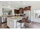 Spacious kitchen with stainless steel appliances, granite countertops, a center island, and stylish pendant lighting at 508 Minerva Dale Dr, Fuquay Varina, NC 27526