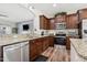 Updated kitchen featuring stainless steel appliances, granite countertops, and ample cabinet space at 508 Minerva Dale Dr, Fuquay Varina, NC 27526