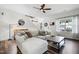 Comfortable living room featuring stylish decor, a ceiling fan, and a staircase leading to the upper level at 508 Minerva Dale Dr, Fuquay Varina, NC 27526
