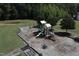 Aerial view of a modern playground with slides, swings, and climbing structures, surrounded by woodchips at 508 Minerva Dale Dr, Fuquay Varina, NC 27526