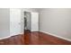 Bedroom featuring hardwood floors and two large closets at 5416 Kissimmee Ln, Raleigh, NC 27616