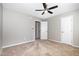 This bedroom features neutral walls, carpet flooring, and a ceiling fan at 5416 Kissimmee Ln, Raleigh, NC 27616