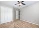 This bedroom features neutral walls, carpet flooring, a closet and a ceiling fan at 5416 Kissimmee Ln, Raleigh, NC 27616