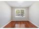 A bedroom featuring a large window and hardwood floors at 5416 Kissimmee Ln, Raleigh, NC 27616