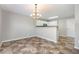 Bright dining area with stylish chandelier, kitchen access, and ample space at 5416 Kissimmee Ln, Raleigh, NC 27616
