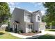 Well-maintained two-story home with gray siding, manicured lawn, and a welcoming walkway at 5416 Kissimmee Ln, Raleigh, NC 27616