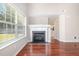 Living room features wood floors, fireplace and natural light at 5416 Kissimmee Ln, Raleigh, NC 27616