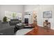Spacious living room with a fireplace, hardwood floors, and ample natural light at 5416 Kissimmee Ln, Raleigh, NC 27616