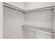 Spacious walk-in closet with wood shelving and ample storage space at 5420 Roan Mountain Pl, Raleigh, NC 27613