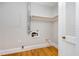 Storage area with hardwood floors, access to plumbing and electrical at 5513 Parkwood Dr, Raleigh, NC 27612