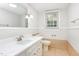Bathroom with tile flooring, updated fixtures, and a modern design at 5513 Parkwood Dr, Raleigh, NC 27612