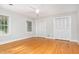 Bedroom featuring hardwood flooring, great light, and double closets at 5513 Parkwood Dr, Raleigh, NC 27612