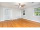 Bedroom featuring hardwood flooring, great light, and double closets at 5513 Parkwood Dr, Raleigh, NC 27612
