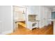 Bright kitchen features custom cabinets, granite countertops, mosaic backsplash, and hardwood flooring at 5513 Parkwood Dr, Raleigh, NC 27612