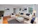 Cozy living room with neutral decor, hardwood floors, and natural light at 5513 Parkwood Dr, Raleigh, NC 27612