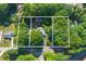 Aerial view of the property showcasing its location, boundary lines, and surrounding lush greenery at 5517 Spring Rd, Raleigh, NC 27603