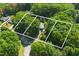 Aerial shot of the property showcasing boundary lines and wooded surroundings at 5517 Spring Rd, Raleigh, NC 27603
