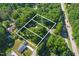 Aerial view highlighting the property's location and beautiful surrounding trees at 5517 Spring Rd, Raleigh, NC 27603