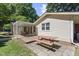 Inviting backyard with a patio, deck, and dining table. Perfect for outdoor entertaining at 5517 Spring Rd, Raleigh, NC 27603