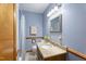 Cozy bathroom with a single vanity, granite countertop, and shower-tub combination at 5517 Spring Rd, Raleigh, NC 27603