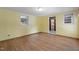Bedroom with vinyl floors, windows for natural light and access to an attached bathroom at 5517 Spring Rd, Raleigh, NC 27603