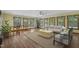 Spacious living area filled with natural light, laminate floors, and comfortable seating at 5517 Spring Rd, Raleigh, NC 27603