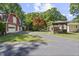 Expansive property showcasing a red barn, gazebo, and landscaped yard with mature trees at 5517 Spring Rd, Raleigh, NC 27603