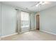 Comfortable bedroom with neutral walls, a large window, and a view to the doorway, creating a cozy atmosphere at 5622 Osprey Cove Dr, Raleigh, NC 27604
