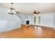 Inviting living room boasts hardwood floors, a cozy fireplace, and easy access to the outdoors through glass doors at 5622 Osprey Cove Dr, Raleigh, NC 27604