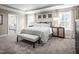 Serene main bedroom features soft lighting, tray ceilings, carpeted floors, and large windows with views at 568 Impala, Wendell, NC 27591