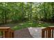 View of a backyard featuring a patio and wooded area, accessible from a deck at 606 Churton Grove Blvd, Hillsborough, NC 27278