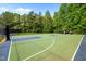 Outdoor basketball court with well-kept surface and greenery, perfect for recreation at 606 Churton Grove Blvd, Hillsborough, NC 27278