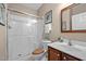 Bathroom featuring walk-in shower, wood vanity, and ceramic tile, for a fresh and clean look at 606 Churton Grove Blvd, Hillsborough, NC 27278