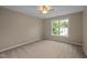 Bedroom with neutral walls, carpeted floor, ceiling fan, and a window at 606 Churton Grove Blvd, Hillsborough, NC 27278