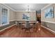 Spacious dining room featuring hardwood floors, decorative chandelier, and room to entertain at 606 Churton Grove Blvd, Hillsborough, NC 27278