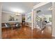 Formal dining room with hardwood floors, elegant lighting, and staircase to the second floor at 606 Churton Grove Blvd, Hillsborough, NC 27278