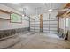 Spacious two car garage with two garage doors, overhead lighting and room for storage at 606 Churton Grove Blvd, Hillsborough, NC 27278